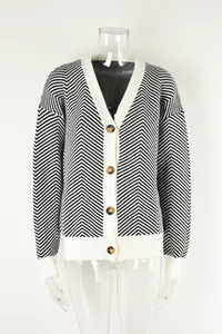 Detailed view of a women's black and white chevron knit V-neck cardigan with buttons