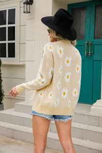 Back view of women's beige knit cardigan with white daisy flower prints and ribbed hem