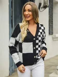 Elegant detail view of a black and white checkered patchwork knit cardigan sweater for women