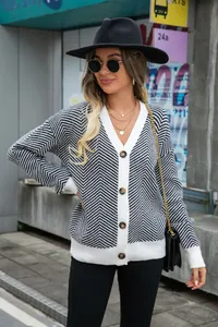 Detail of women's black and white chevron knit cardigan with V-neck and buttons