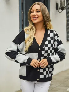 Detail of women's checkered patchwork knit cardigan with V-neck and button closure