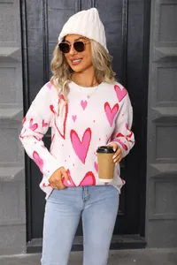 Casual women's knit sweater featuring pink heart patterns and stylish crew neck design.