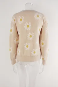 Back view of a beige knit sweater featuring a white and yellow daisy floral print