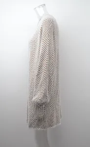 Side view detail of a long knit cardigan featuring a stylish brown and white chevron pattern.
