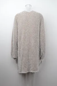 Back view of a fuzzy oversized chevron patterned knit cardigan in brown and white
