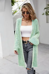 Macro detail view of mint green chevron pattern fuzzy knit long cardigan for women