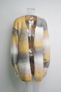 Detail of oversized rainbow striped knit cardigan sweater for women in winter