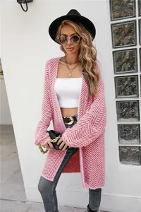 Detail view of pink chevron fuzzy knit cardigan with long sleeves and open front