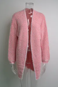 Detailed view of pink chevron patterned fuzzy knit cardigan on a transparent mannequin.