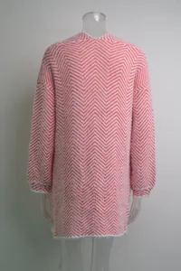 Back view of a pink and white chevron pattern fuzzy mid-length cardigan on a mannequin.