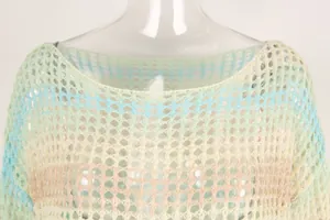 Close-up detail of multi-color striped hollow crochet knit texture on beach cover-up