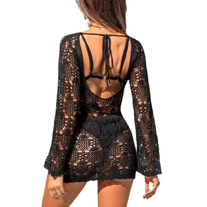 Elegante vestido de playa de ganchillo negro con mangas largas y diseño sexy de espalda abierta