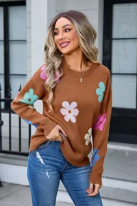 Full view of stylish brown crewneck sweater featuring vibrant colorful knit flower patterns