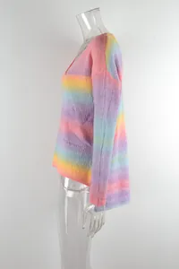 Side detail view of a women's rainbow tie-dye gradient knit sweater with an irregular hem