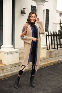 Detail view of a stylish women's long fringe knit cardigan with geometric patterns