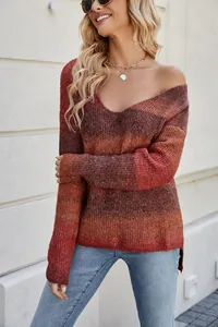 Detail of women's ombre knitted sweater with V-neck and gradient texture.