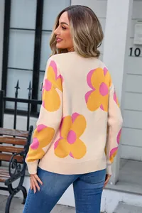 Women's beige crew neck sweater with large pink and yellow floral patterns, back view