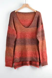 Close-up detail of a women's V-neck tie-dye sweater with warm orange and red gradient