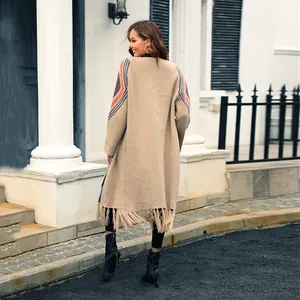 Elegant long-length knitted cardigan for women featuring stylish fringes and sleeve patterns