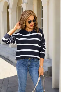 Stylish relaxed navy blue and white striped knit sweater for retro autumn look.
