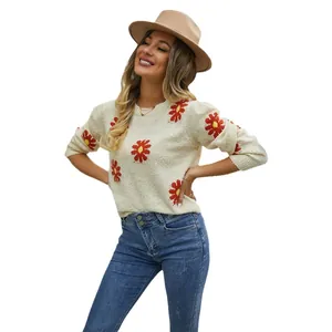 Fashionable women's cream sweater with vibrant red daisy patterns and a round neck
