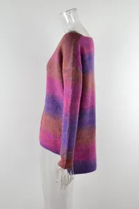 Detailed side view showing the asymmetric cut and texture of this gradient sweater.