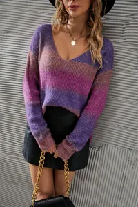 Detail view of the V-neck gradient tie-dye knit sweater in purple and pink tones.