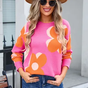 Vibrant pink women's crew neck sweater with large orange floral pattern knitwear