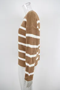 Detailed side view of a cozy brown and white striped knit sweater on a mannequin