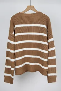 Detailed view of brown and white horizontal stripes on a cozy vintage style knit sweater
