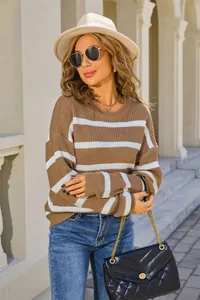 Detail view of a retro brown and white striped oversized sweater for autumn fashion.