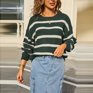 Stylish retro oversized striped knit sweater in dark green and white for autumn.