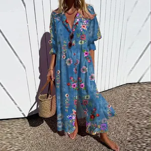 Detailed view of an elegant blue floral maxi dress with long sleeves and lapel collar