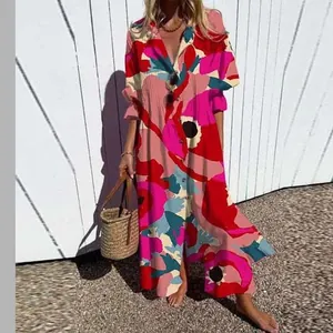 Detail view of colorful floral print on an elegant collared maxi dress for women
