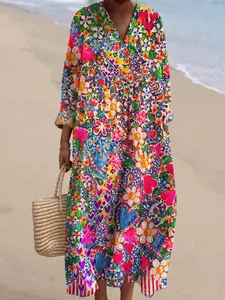 Elegant V-neck long maxi dress featuring a vibrant floral and heart print in a loose fit