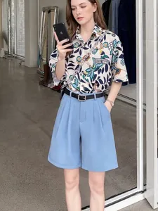 Stylish high-waisted light blue casual shorts with black belt for women's summer fashion