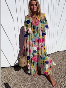 Elegant women's long dress featuring vibrant floral prints and a classic lapel design