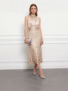 Elegant champagne satin halter long dress featuring a textured circular applique skirt design