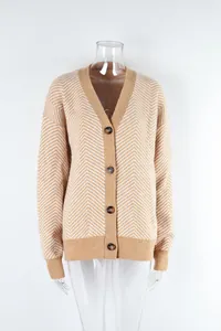 Close-up of beige chevron knit cardigan on transparent mannequin