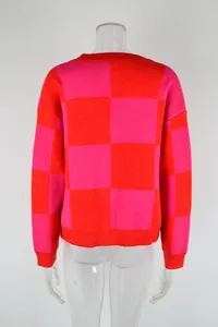 Detailed back view of a vibrant pink and orange checkered patchwork knit sweater for women