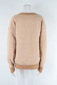 Back view of a women's knitted cardigan with a stylish beige and white chevron pattern