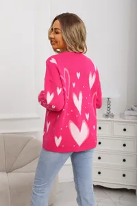Back view of a cozy pink knit sweater featuring white heart patterns and ribbed crew neck