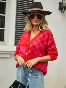 Red and pink checkered knit cardigan sweater shown on a model in an outdoor setting