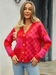 Front view of women's checkerboard knit cardigan with pink and red patchwork design