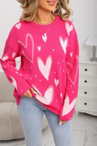 Detailed macro view of the soft pink knitted texture and sweet heart pattern design