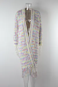 Macro view of long open-front cardigan featuring colorful knit and fringe detail
