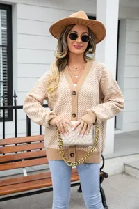 Stylish woman in a beige chevron V-neck cardigan paired with a classic fedora hat