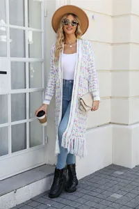 Detailed view of a multi-color long cardigan with tassel hem and soft knit texture