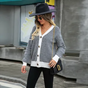 Stylish women's V-neck cardigan featuring black and white chevron knit pattern.
