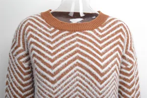 Close-up detail of a brown and white chevron fuzzy knit sweater with crew neckline